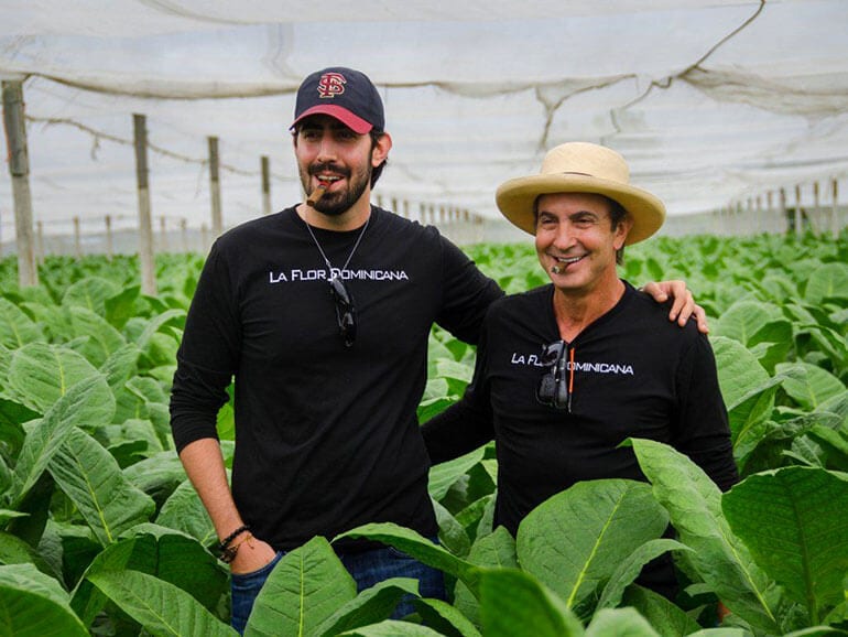 La Flor Dominicana's Tony & Litto Gomez in a tobacco field